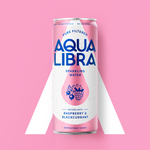 Aqua Libra sparkling water can on a pink background